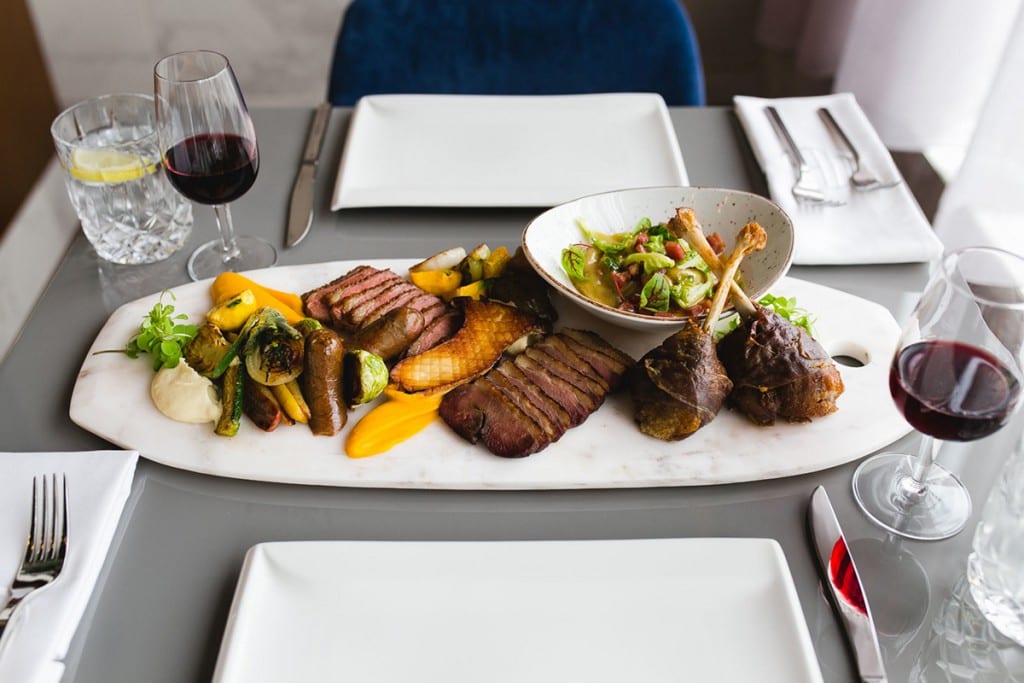 a steak dinner with wine at Hopkins