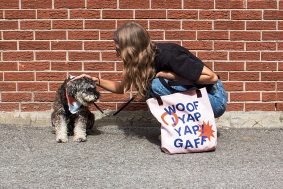 a woman petting a dog